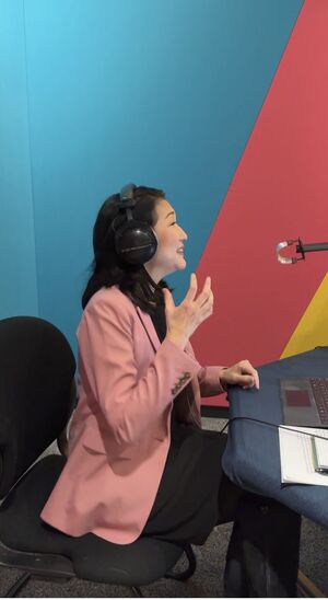 CEO Michelle Kang recording a podcast episode.