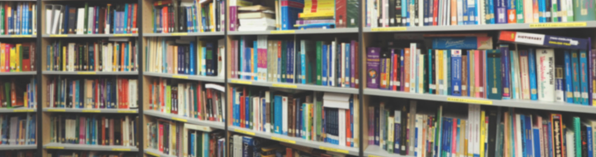 Rows of bookshelves in the ISPA Research Library containing industry studies and reports