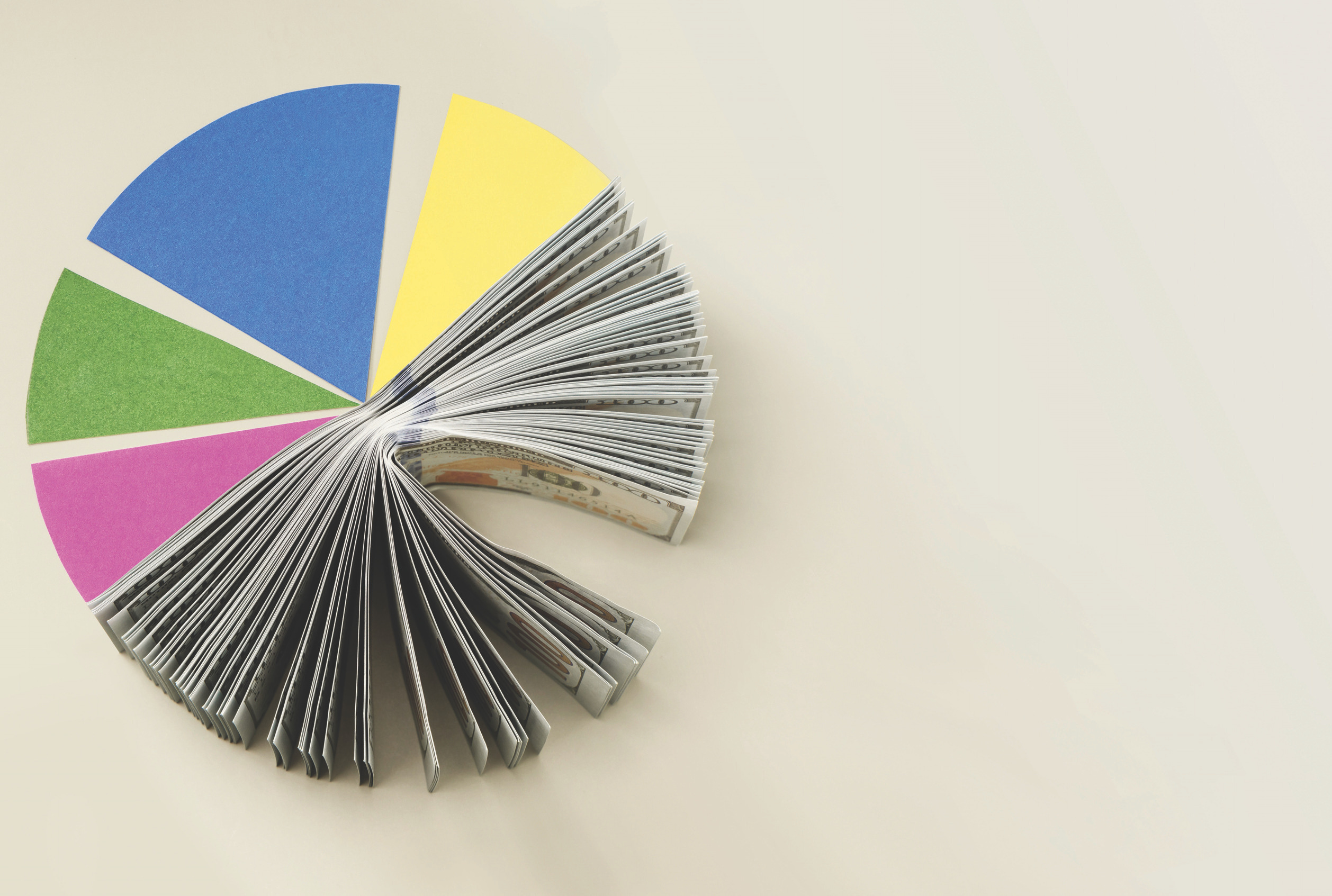 Open book or fan of pages arranged with colored wedges, illustrative of data breakdowns