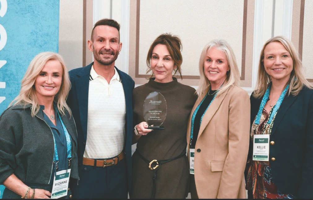 Group photograph of Michelle Kelthy and colleagues holding the Marriott Spa Director of the Year award