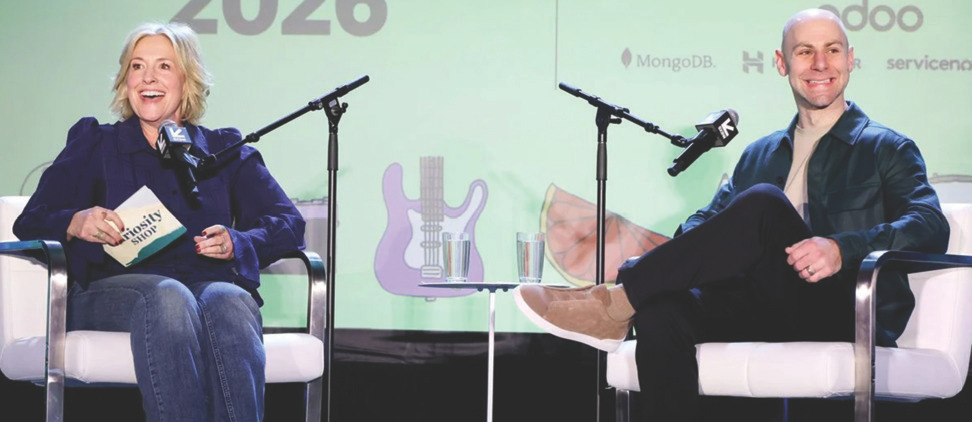 Photo of Bren&eacute; Brown and Adam Grant speaking on a stage during a live event