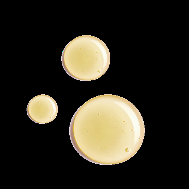 Golden body oil droplets