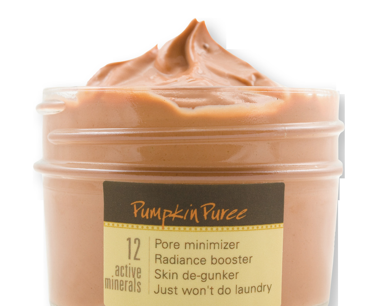 Jar of pumpkin puree with whipped pumpkin-coloured cream on top