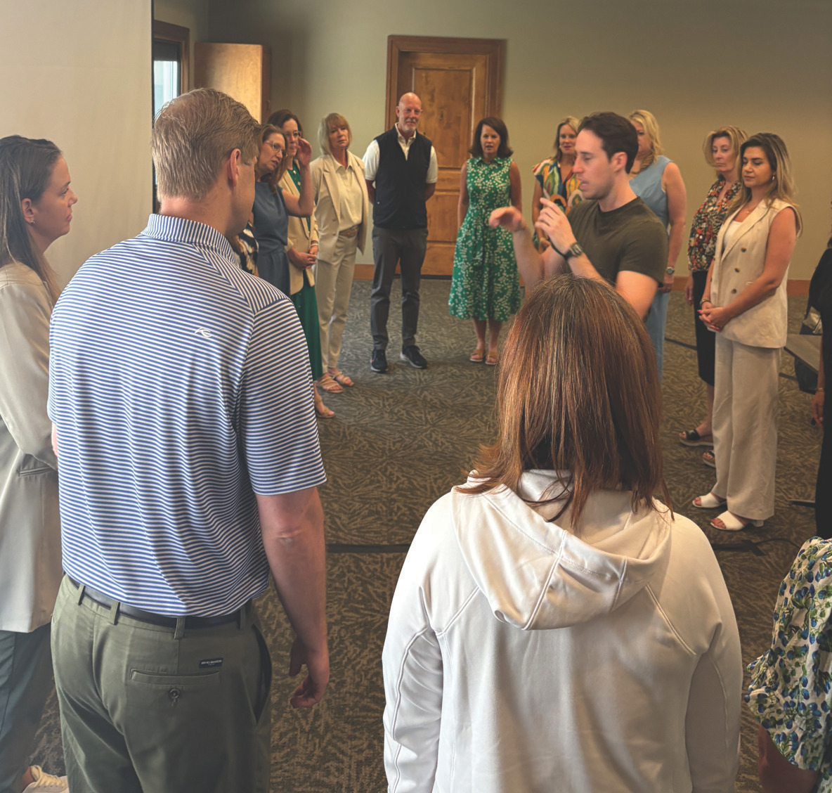 ISPA Board members participating in a light-hearted group activity led by a Miraval team member