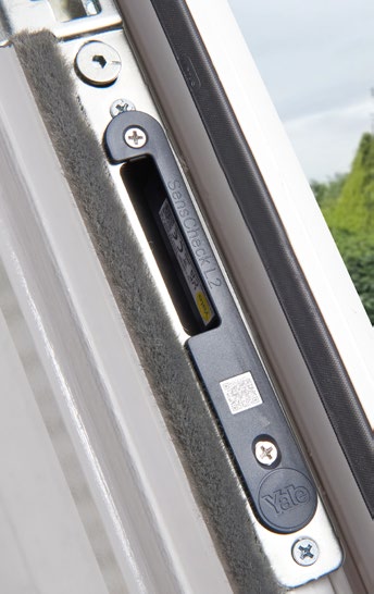 Close-up of a Yale SensCheck L2 keep-mounted sensor installed in a door keep