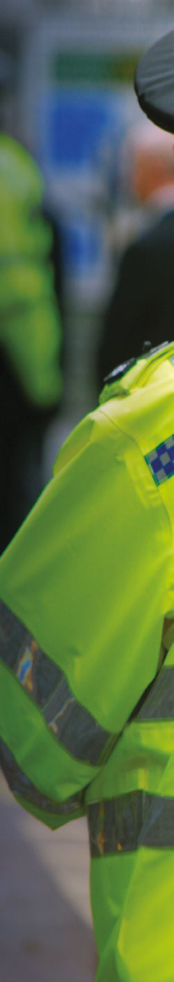 A police officer in a high-visibility jacket, symbolizing the Secured by Design initiative