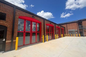 Close-up of red glazed appliance bay doors at Lowndes County Fire Station