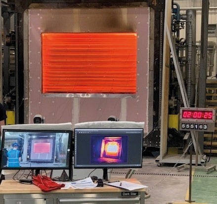 Shutter test rig showing an orange/red shutter and thermal imaging monitors