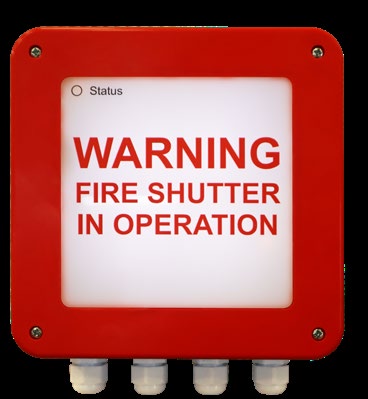 Close-up view of EFP1 warning device with text 'WARNING FIRE SHUTTER IN OPERATION' mounted on a wall