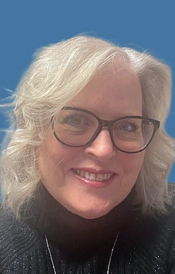 Portrait of DHF CEO Patricia Sowsbery-Stevens, smiling