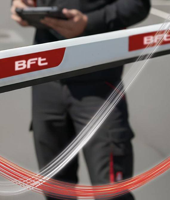 Close-up detail of a BFT barrier arm and mechanism with branded graphic