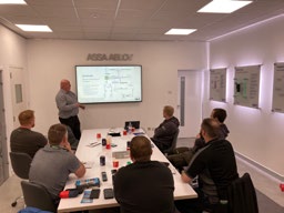 Abloy Partner Program presentation in a training room with attendees
