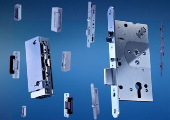 Exploded view of electromechanical lock components and electric strikes on a blue background