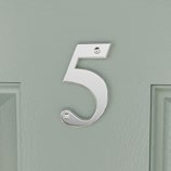 Silver numeral '5' mounted on a mint-green door.
