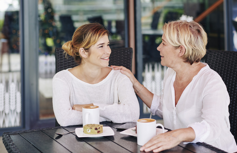 Two women talking over coffee