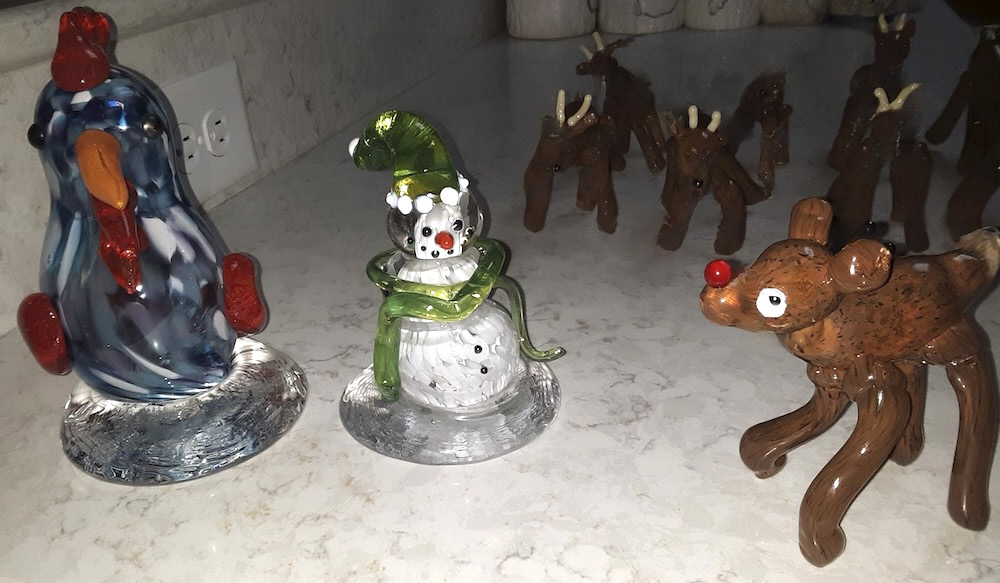 Several small glass ornaments arranged on a countertop