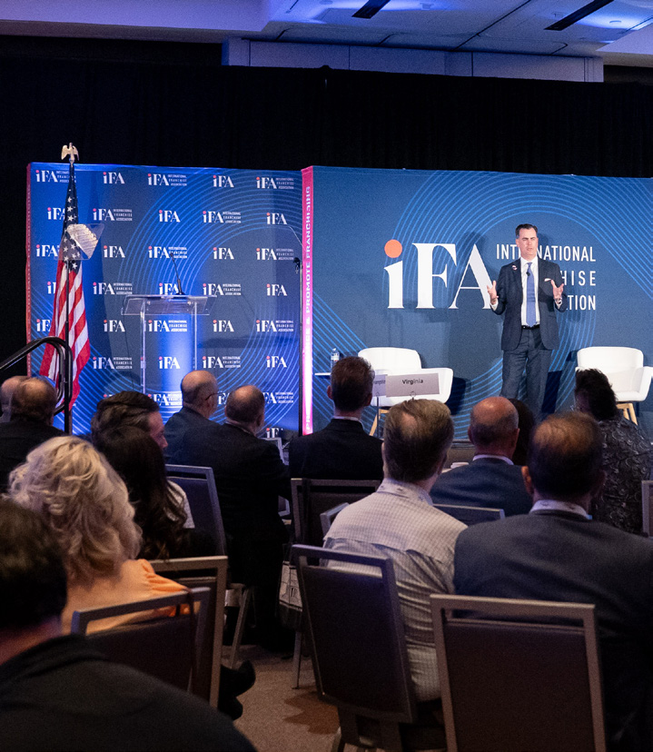 Speaker Scott Jennings on stage at the IFA Advocacy Summit