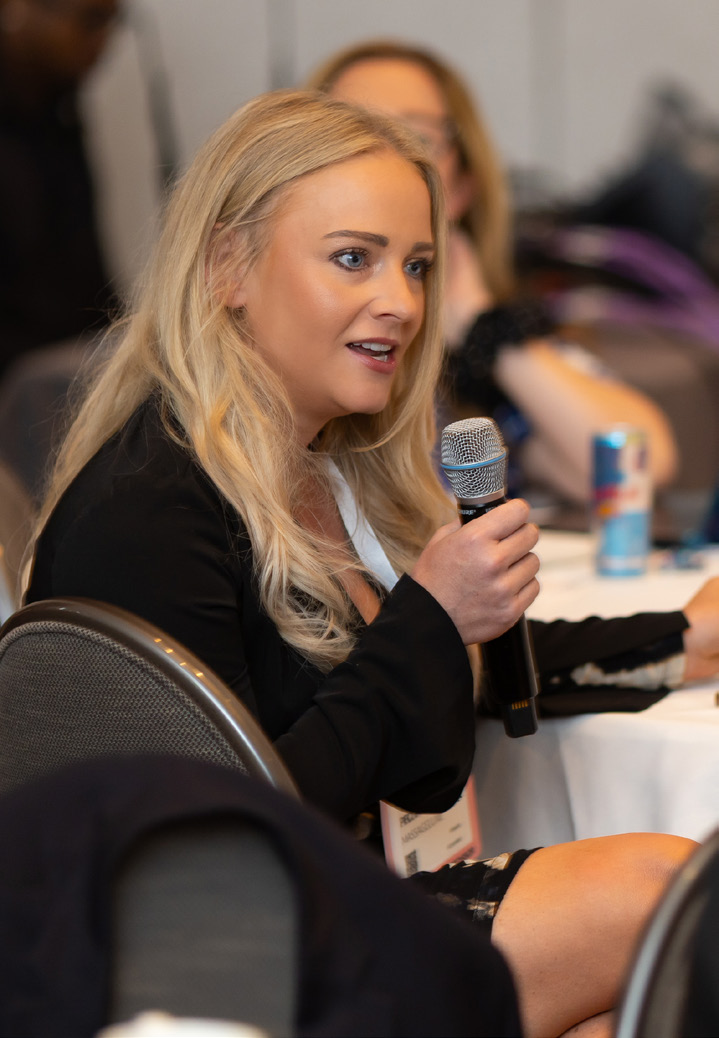 Female industry expert speaking during a panel session