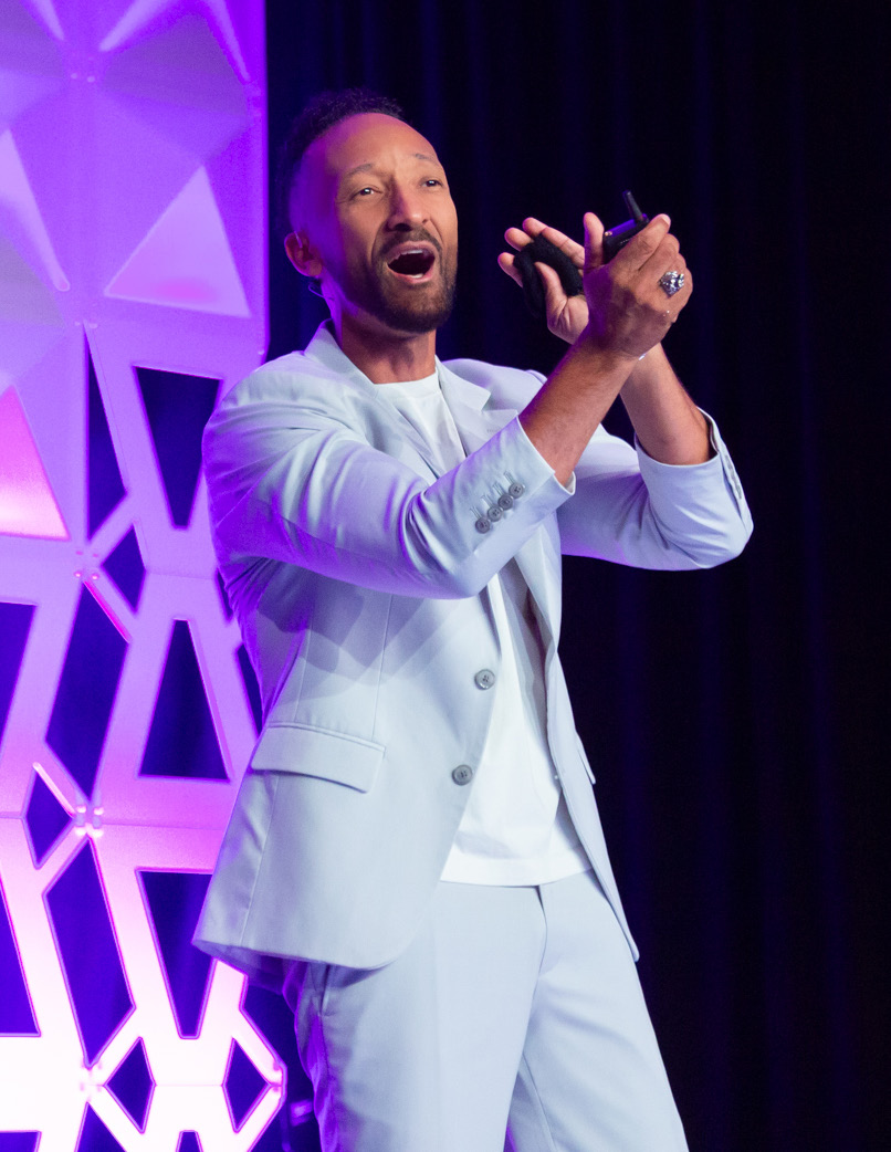 A speaker at the FLDC25 conference stage