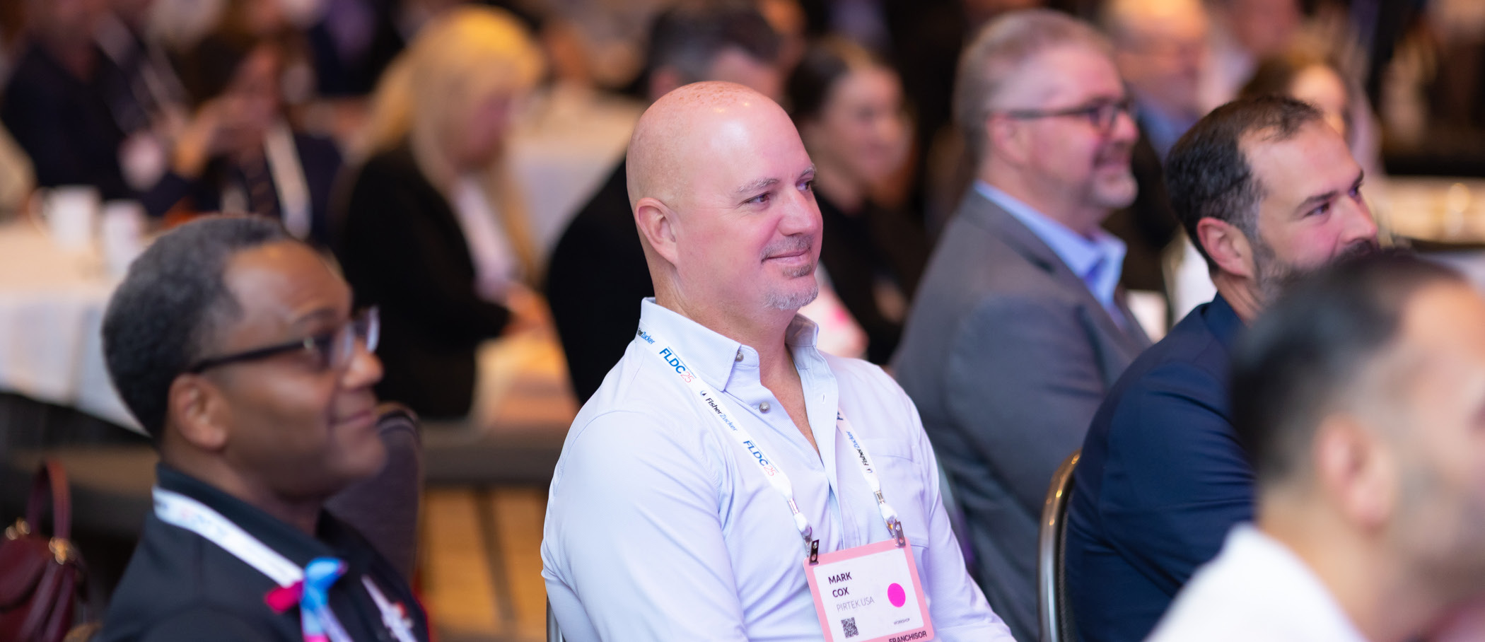 Attentive audience members sitting in a session at the 2025 FLDC conference